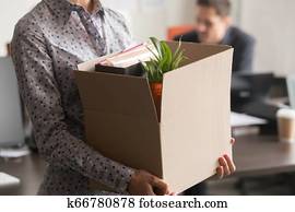 Close up view of new female employee intern holding box Close up view of new female employee intern holding box