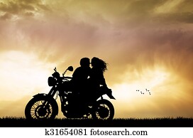 couple kissing on motorbike couple kissing on motorbike