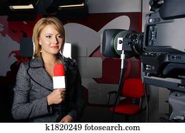attractive television news reporter and video camera attractive television news reporter and video camera
