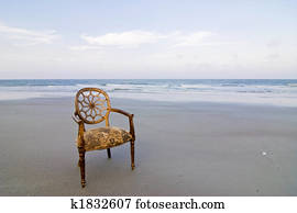 ornate chair on beach