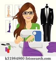 dressmaker woman using sewing machine