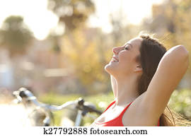 Woman breathing fresh air and relaxing