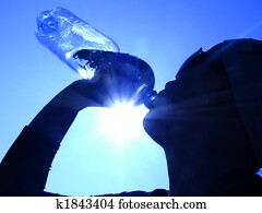 woman drinking water in the sun woman drinking water in the sun