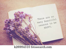 Inspirational motivating quote on notebook and flower with retro Inspirational motivating quote on notebook and flower with retro