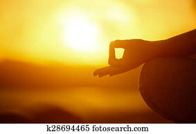 Yoga concept. hand woman practicing lotus pose on beach 