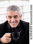 Businessman drinking tea