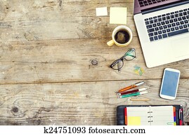 Desktop mix on a wooden office table.