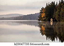 Lake in Autumn sunrise reflection