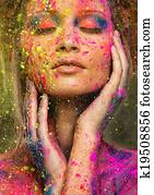 Young woman muse with creative body art and hairdo Young woman muse with creative body art and hairdo