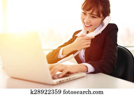 young   businesswoman working in the office at morning