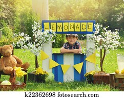 Boy Selling Yellow Lemonade at Stand Boy Selling Yellow Lemonade at Stand