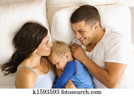 Family in bed. Family in bed.