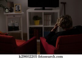 Lonely woman alone at home