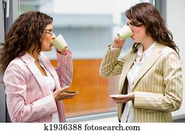 Businesswomen drinking coffee