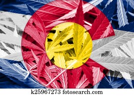 Colorado State Flag on cannabis background. Drug policy. Legalization of marijuana Colorado State Flag on cannabis background. Drug policy. Legalization of marijuana
