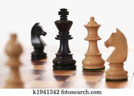 Chess game white queen challenging black king Chess game white queen challenging black king