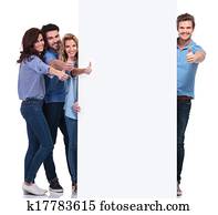 group of people making the ok sign while presenting board