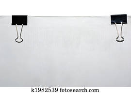 Block of paper and black paper clips with empty space for text or design.