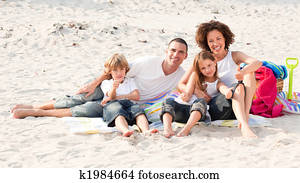 Family playing sitting on a beach Family playing sitting on a beach