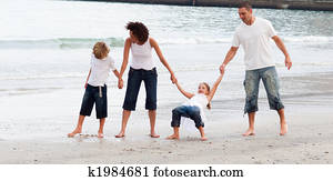Family walking on a beach