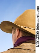 Man wearing cowboy hat.