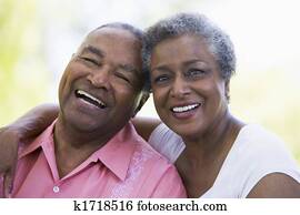 Senior couple sitting outdoors Senior couple sitting outdoors
