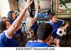 fans or friends watching football at sport bar fans or friends watching football at sport bar