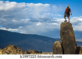 Rock climber nearing the summit.