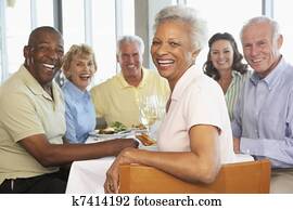 Friends Having Lunch Together At A Restaurant