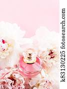 Luxurious fragrance bottle as chic perfume product on background of peony flowers, parfum ad and beauty branding Luxurious fragrance bottle as chic perfume product on background of peony flowers, parfum ad and beauty branding