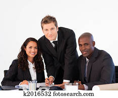 Business team in a meeting looking at the camera