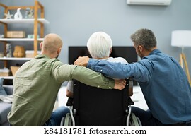 Family Watching TV In Living Room Family Watching TV In Living Room