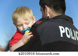 Police Officer Holds baby Police Officer Holds baby
