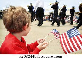 Young boy watching the memorial day parade