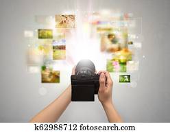 Hand captures life events with digital camera