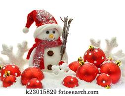 Snowman and Christmas ornaments on snow Snowman and Christmas ornaments on snow