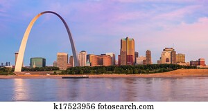 St Louis Arch and skyline at the Mississippi river at sunrise