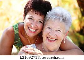Beautiful senior mother and daughter smiling
