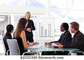 Female manager smiling at her team in a meeting