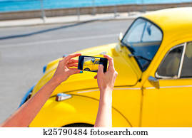 Photographing old yellow car