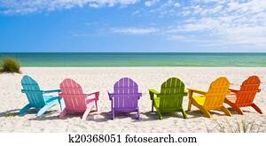 Adirondack Beach Chairs on a Sun Beach in front of a Holiday Vac