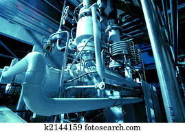 Pipes, tubes, machinery and steam turbine at a power plant Pipes, tubes, machinery and steam turbine at a power plant