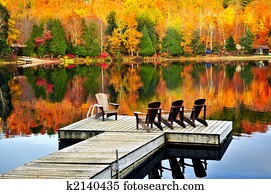 Wooden dock on autumn lake
