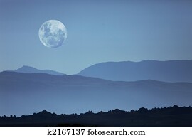 Ghostly Mountain Silhouettes and Moon