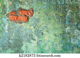 Damaged old brick wall with hole