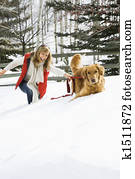 Woman playing with dog.