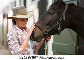 cowgirl talking to a horse cowgirl talking to a horse