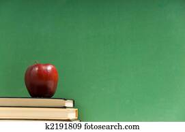 School books and chalkboard School books and chalkboard