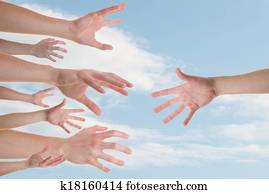 Hands reaching for a helping hand