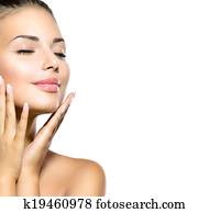 Beauty Spa Woman Portrait. Beautiful Girl Touching her Face